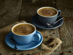 hot coffee in stylish mugs